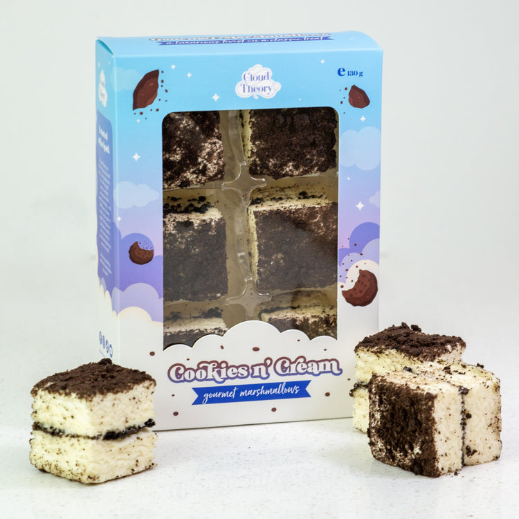Cookies 'n' Cream marshmallow bars with packaging on a white background