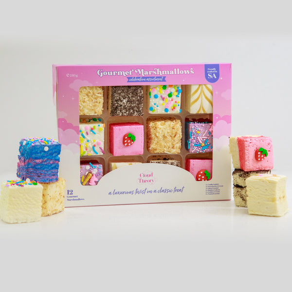 Box of Gourmet Marshmallows with marshmallow treats in front on a white background