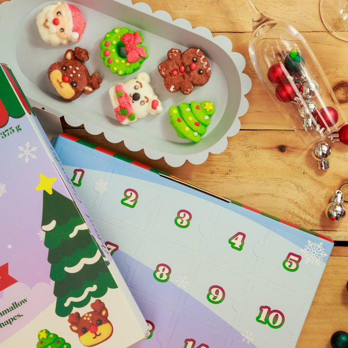 Santa, wreath, gingerbread figure, reindeer, polar bear and Christmas tree marshmallow gummies on a tray