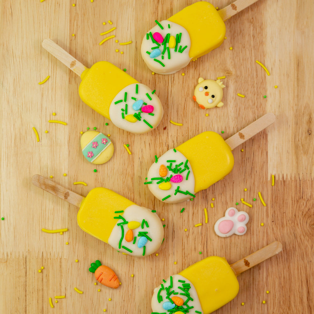 Easter Edition Dream Pop featuring a fluffy marshmallow in the shape of a popsicle, dipped in creamy white chocolate and decorated with festive Easter sprinkles. A perfect Easter gift or party treat.