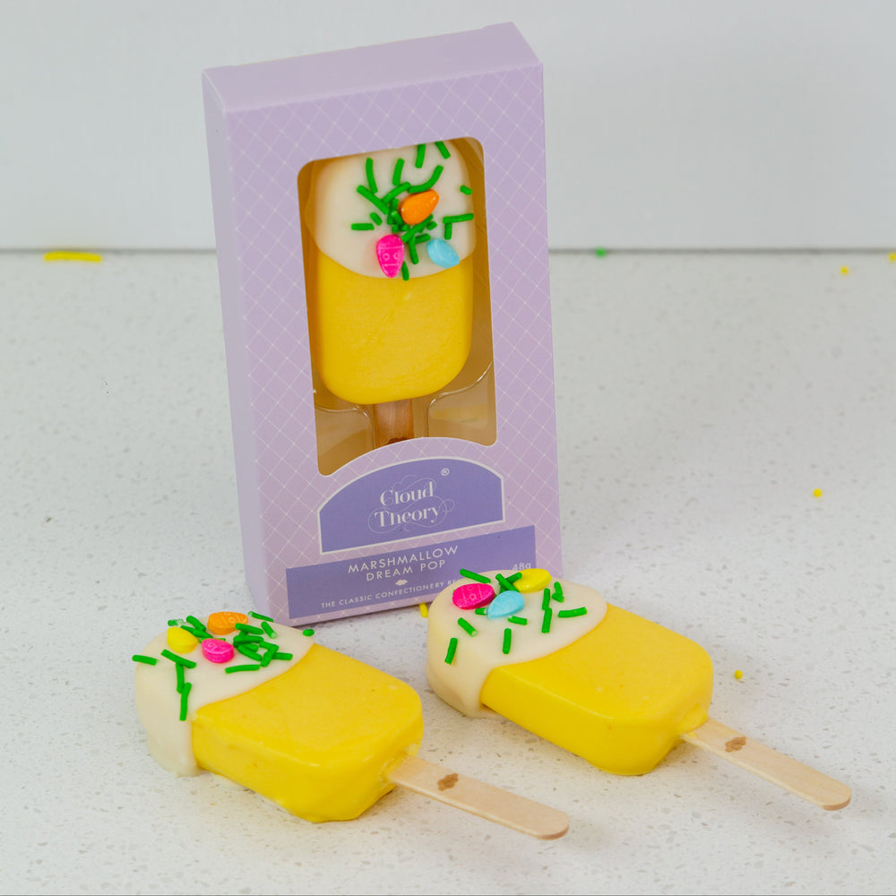 Easter Edition Dream Pop featuring a fluffy marshmallow in the shape of a popsicle, dipped in creamy white chocolate and decorated with festive Easter sprinkles. A perfect Easter gift or party treat.