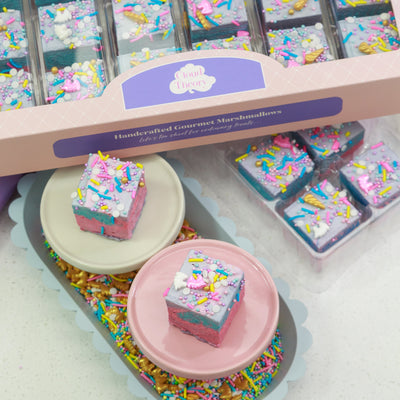 24-piece Rainbow Unicorn marshmallow box featuring pastel-coloured fairy floss marshmallows with whimsical unicorn sprinkles. Perfect for unicorn-themed parties and magical birthday celebrations.
