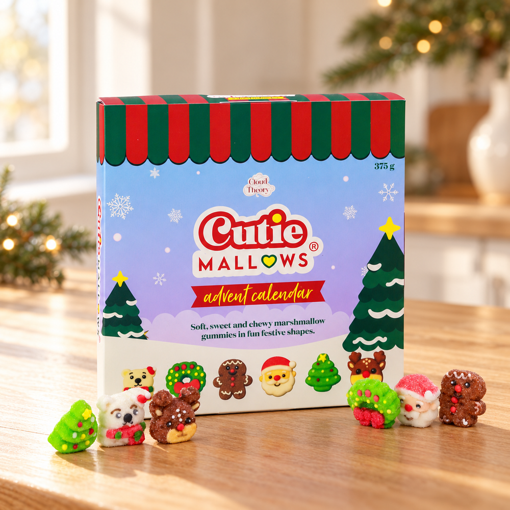 Cutie Mallows 375 g Advent Calendar with six festive marshmallow gummies on a wooden table in a Christmas setting