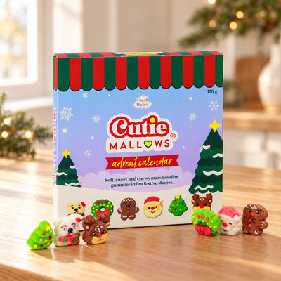 Cutie Mallows 375 g Advent Calendar with six festive marshmallow gummies on a wooden table in a Christmas setting