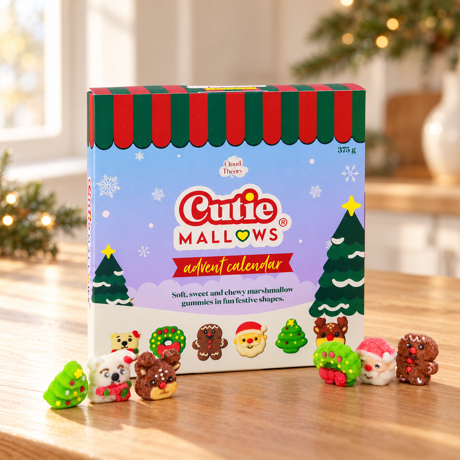 Cutie Mallows 375 g Advent Calendar with six festive marshmallow gummies on a wooden table in a Christmas setting