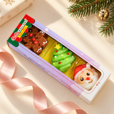 Cutie Mallows Christmas 3-piece sleeve beside pink ribbon and festive greenery