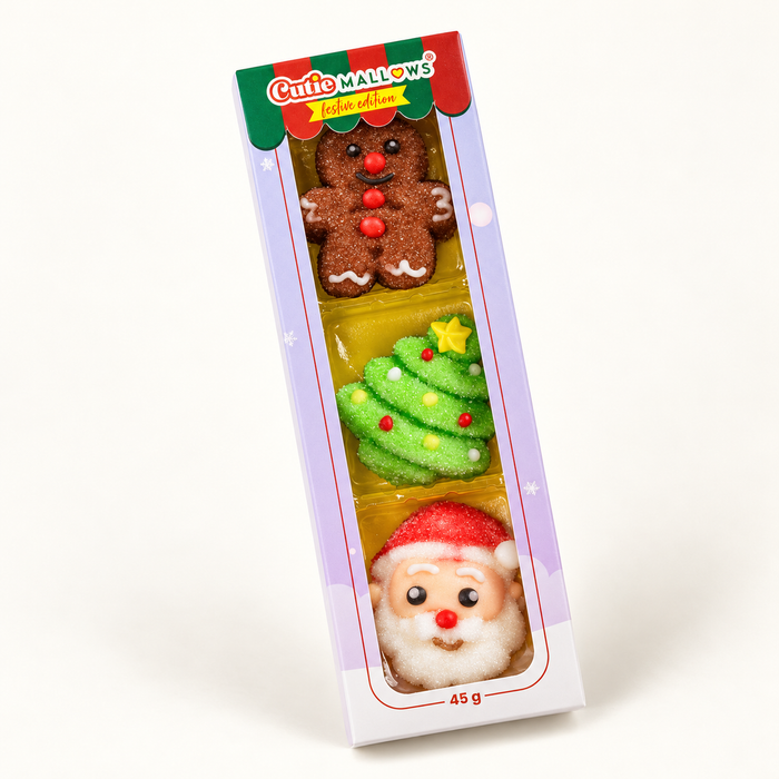 Cutie Mallows Christmas 3-piece sleeve with gingerbread, Christmas tree and Santa marshmallow gummies on a cream background